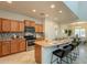 Modern kitchen with granite countertops, stainless steel appliances, and a breakfast bar with seating at 1634 W Red Bird Rd, Phoenix, AZ 85085