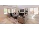 Bright and airy living room with neutral decor, tile flooring, and lots of natural light at 1634 W Red Bird Rd, Phoenix, AZ 85085