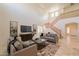 Comfortable living room with high ceilings, stylish furnishings, and a staircase leading to the upper level at 1634 W Red Bird Rd, Phoenix, AZ 85085
