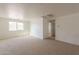 Bright loft area with natural light, plush carpeting, and versatile space for various activities at 1634 W Red Bird Rd, Phoenix, AZ 85085