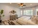 Cozy main bedroom with stylish furnishings, plank flooring, and natural light from multiple windows at 1634 W Red Bird Rd, Phoenix, AZ 85085
