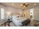Spacious main bedroom with access to an ensuite bathroom and a cozy seating area at 1634 W Red Bird Rd, Phoenix, AZ 85085