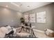Inviting home office with a minimalist design, chic seating, and natural light at 1634 W Red Bird Rd, Phoenix, AZ 85085