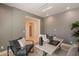 Comfortable office featuring stylish seating, a modern desk, and an open layout at 1634 W Red Bird Rd, Phoenix, AZ 85085