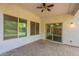 Covered patio with pavers, ceiling fan, and access to interior, perfect for outdoor living at 1634 W Red Bird Rd, Phoenix, AZ 85085