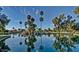 Scenic community pond with lush landscaping, waterfalls, and serene water views at 17224 N Zuni Trl, Surprise, AZ 85374