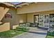 Village Salon entrance with outdoor seating, manicured landscaping, and a welcoming ambiance at 17224 N Zuni Trl, Surprise, AZ 85374