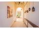 Charming entryway featuring decorative lanterns, artwork, and an arched entrance to a green front door at 1787 E Sattoo Way, Queen Creek, AZ 85140