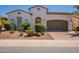 Beautiful single-story home with desert landscaping, brick driveway, and a well-maintained front yard at 1787 E Sattoo Way, Queen Creek, AZ 85140