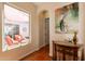 Hallway view to an outdoor lounge, with an ornate cabinet and interior design at 1787 E Sattoo Way, Queen Creek, AZ 85140