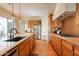 Gourmet kitchen with granite counters, a central island and stainless steel appliances at 1787 E Sattoo Way, Queen Creek, AZ 85140