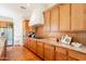 Well-equipped kitchen features granite countertops and stainless steel appliances at 1787 E Sattoo Way, Queen Creek, AZ 85140