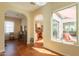 Open-concept living area with tile flooring, large windows, and plenty of light at 1787 E Sattoo Way, Queen Creek, AZ 85140