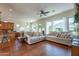 Spacious open-concept living room with tile flooring, comfortable seating, and natural light at 1787 E Sattoo Way, Queen Creek, AZ 85140