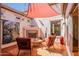 Inviting outdoor patio with fireplace and comfortable seating area at 1787 E Sattoo Way, Queen Creek, AZ 85140