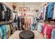 Spacious walk-in closet with organized racks and storage solutions for clothes and accessories at 1787 E Sattoo Way, Queen Creek, AZ 85140