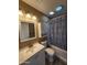 Bathroom with a vanity, toilet, medicine cabinet and a bathtub with shower at 1810 N Mcdonald St, Casa Grande, AZ 85122