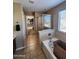Bathroom featuring tile floor, glass shower and walk-in closet view at 1810 N Mcdonald St, Casa Grande, AZ 85122