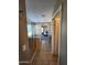 Hallway leads to primary bathroom featuring a glass shower and tile floor at 1810 N Mcdonald St, Casa Grande, AZ 85122