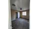 Bedroom with tan walls, carpet floor, a window, and a closet with white doors at 1810 N Mcdonald St, Casa Grande, AZ 85122