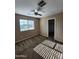 Spacious bedroom featuring neutral walls, plush carpet, and a window offering ample natural light at 1810 N Mcdonald St, Casa Grande, AZ 85122