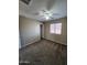 A clean bedroom featuring neutral walls, carpet flooring and a ceiling fan at 1810 N Mcdonald St, Casa Grande, AZ 85122