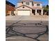 Inviting two-story home featuring a covered porch, a neutral color palette and an attached two car garage at 1810 N Mcdonald St, Casa Grande, AZ 85122