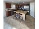 Well-equipped kitchen featuring stainless steel appliances, granite counters, and a central island with breakfast bar seating at 1810 N Mcdonald St, Casa Grande, AZ 85122