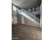 Bright living space featuring high ceilings, large windows, a staircase and neutral color palette at 1810 N Mcdonald St, Casa Grande, AZ 85122
