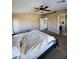 The primary bedroom with ensuite bathroom features carpet and neutral paint at 1810 N Mcdonald St, Casa Grande, AZ 85122