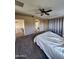 Open Primary suite with ceiling fan, ensuite bathroom and carpet at 1810 N Mcdonald St, Casa Grande, AZ 85122