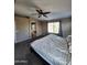 Primary bedroom boasts an ensuite bathroom with a tub and large window at 1810 N Mcdonald St, Casa Grande, AZ 85122
