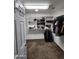 Organized walk-in closet with installed white storage solutions at 1810 N Mcdonald St, Casa Grande, AZ 85122