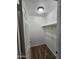 Carpeted walk-in closet with a wood shelf and rod for hanging clothes at 1810 N Mcdonald St, Casa Grande, AZ 85122