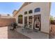 View of backyard featuring gravel, patio, a grill, and desert landscaping at 18221 N 49Th Pkwy, Glendale, AZ 85308