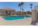 Relaxing community pool area with shade structure and mature palm trees at 18221 N 49Th Pkwy, Glendale, AZ 85308