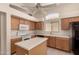 Kitchen features white countertops, light wooden cabinets, and stainless steel sink at 18221 N 49Th Pkwy, Glendale, AZ 85308