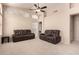 Spacious living room featuring neutral walls and carpet flooring, accompanied by vaulted ceilings at 18221 N 49Th Pkwy, Glendale, AZ 85308