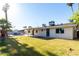 Expansive backyard showcasing a lush lawn and refreshing pool, ideal for outdoor living and entertainment at 1829 E Decatur St, Mesa, AZ 85203