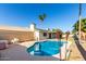 An enticing backyard with a refreshing pool, mature landscaping, and patio with outdoor decor at 1829 E Decatur St, Mesa, AZ 85203