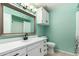 Bathroom boasts a modern sink, black hardware, and a shower-tub combo with a white curtain at 1829 E Decatur St, Mesa, AZ 85203