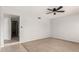 Neutral bedroom with tile flooring and neutral paint with a ceiling fan at 1829 E Decatur St, Mesa, AZ 85203