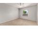 Bedroom showcasing a ceiling fan and natural light from a single arched window at 1829 E Decatur St, Mesa, AZ 85203
