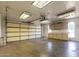 Spacious garage interior featuring ample storage cabinets and bright lighting at 1829 E Decatur St, Mesa, AZ 85203