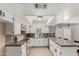 Bright kitchen featuring white cabinetry, tiled countertops, and modern appliances at 1829 E Decatur St, Mesa, AZ 85203