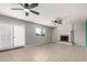 Spacious living room with a fireplace, ceiling fans, and sliding doors at 1829 E Decatur St, Mesa, AZ 85203