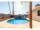 Backyard pool with a spa surrounded by a concrete patio and privacy fence at 1829 E Decatur St, Mesa, AZ 85203
