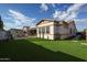 Beautiful backyard featuring a covered patio, outdoor seating, and lush landscaping at 2351 E Cherrywood Pl, Chandler, AZ 85249
