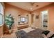 Relaxing bedroom includes a mounted television, walk-in closet, and neutral tones for rest at 2351 E Cherrywood Pl, Chandler, AZ 85249