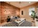Modern bedroom features a wood accent wall, pendant lights, and striking geometric patterns at 2351 E Cherrywood Pl, Chandler, AZ 85249